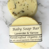 Baby soap bar with a label on a marble background