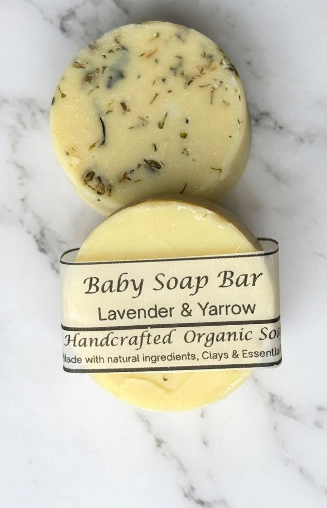 Baby soap bar with a label on a marble background