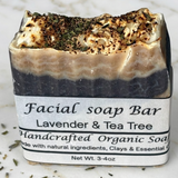 Facial soap bar with lavender and tea tree scent on a marble background