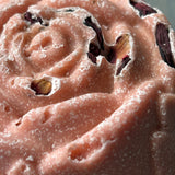 Close-up of pink ice cream with a rose swirl